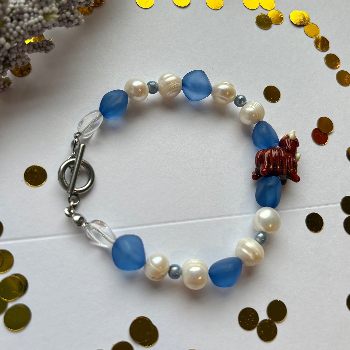 Blue and white freshwater pearl Scottish highland cow bracelet