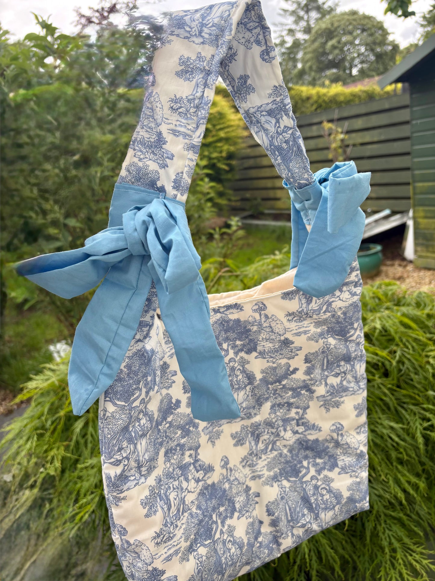 Handmade white and blue porcelain coquette farm print padded tote bag with blue bows