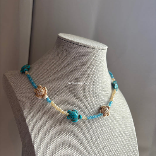 Cool quirky handmade blue and cream beaded beach ocean turtle necklace