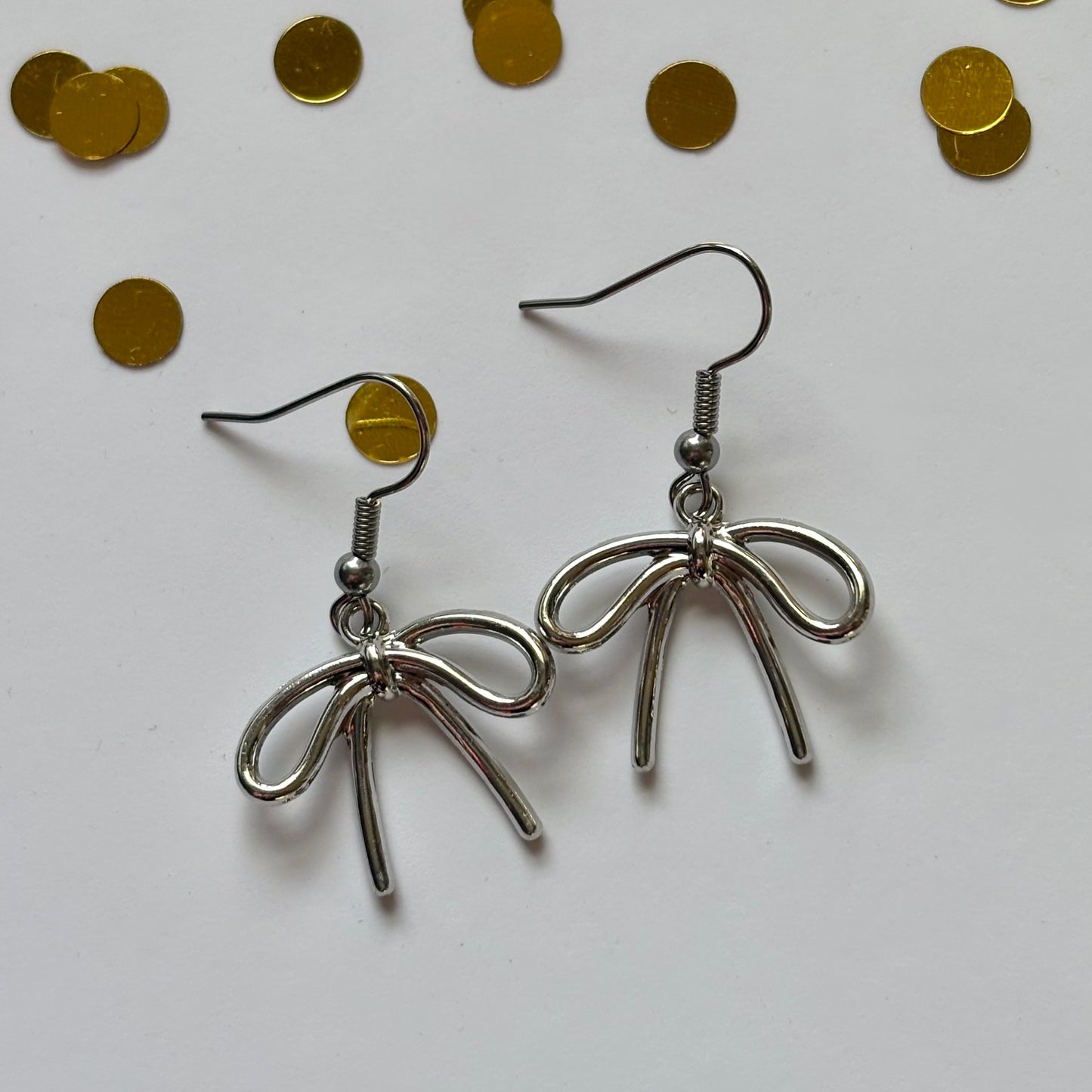 Cool gold or silver dangle bow earrings
