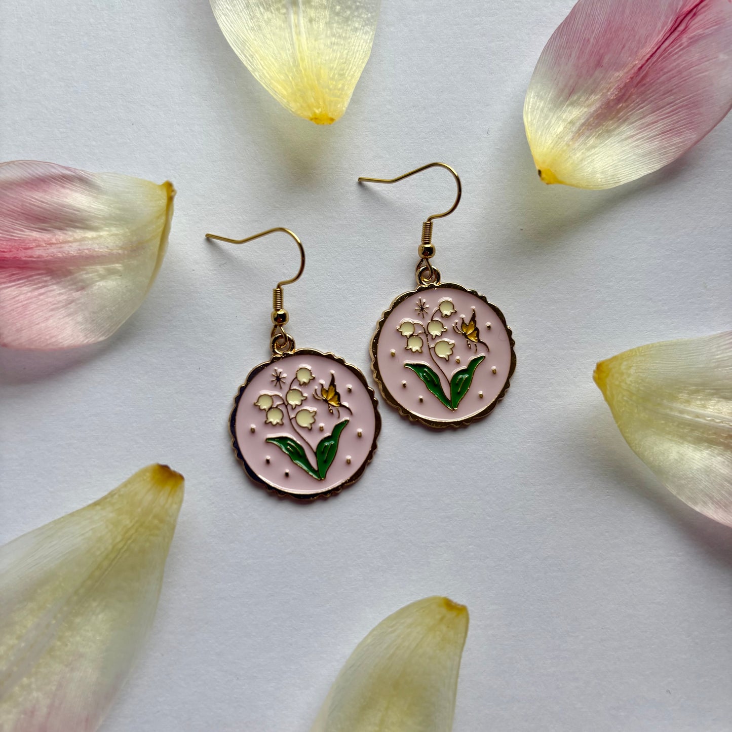 Pink circle with flowers and butterfly dangle gold earrings