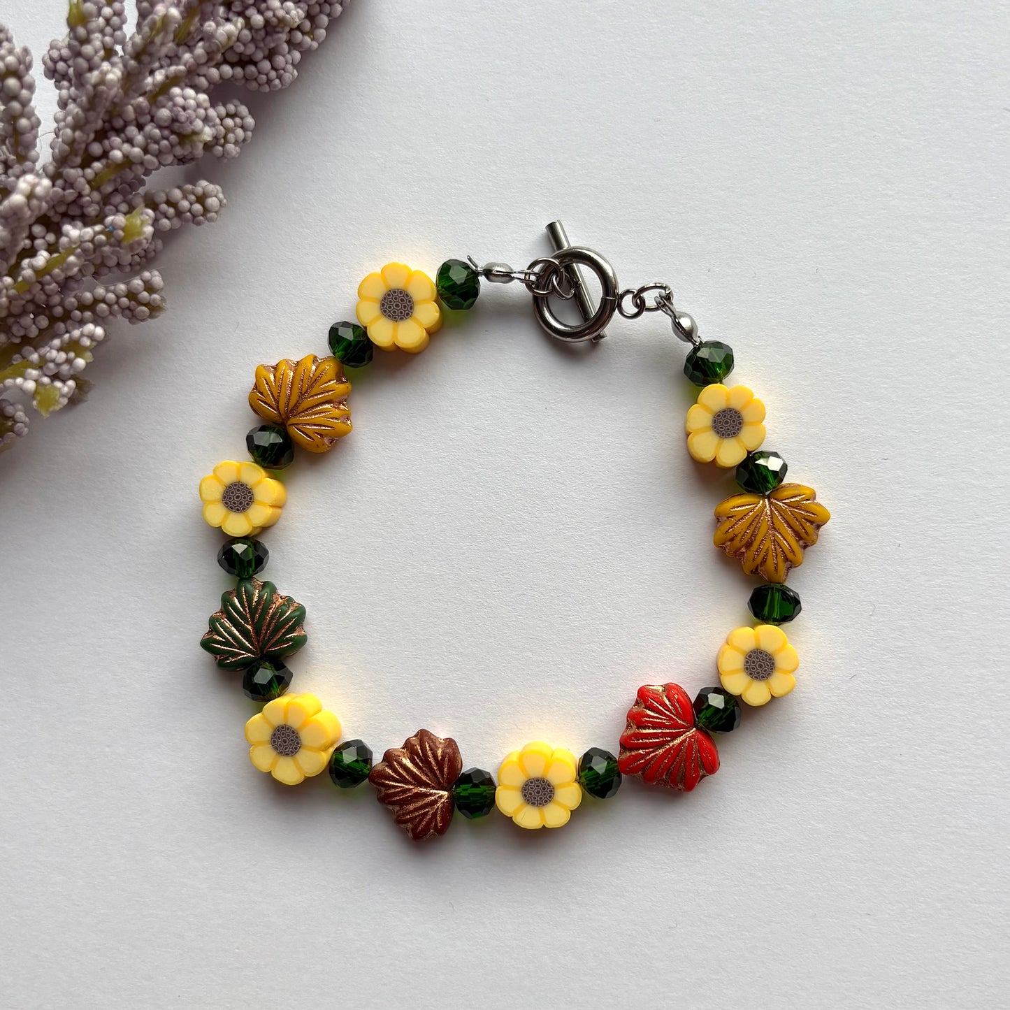 Autumn leaves bracelet - green beads, leaves and sunflowers