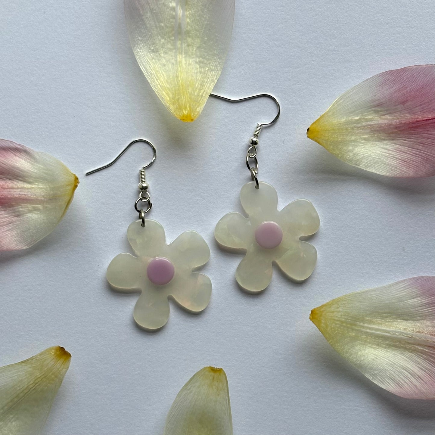 White and yellow or purple opaque flower earrings