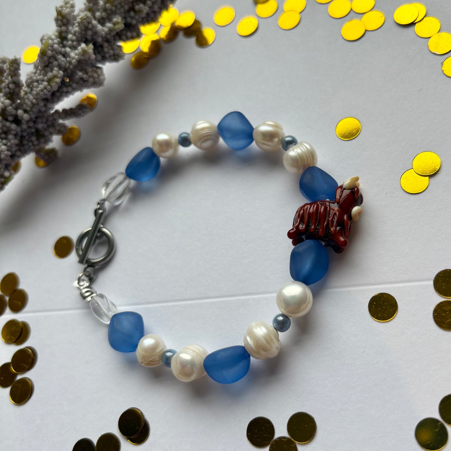 Blue and white freshwater pearl Scottish highland cow bracelet