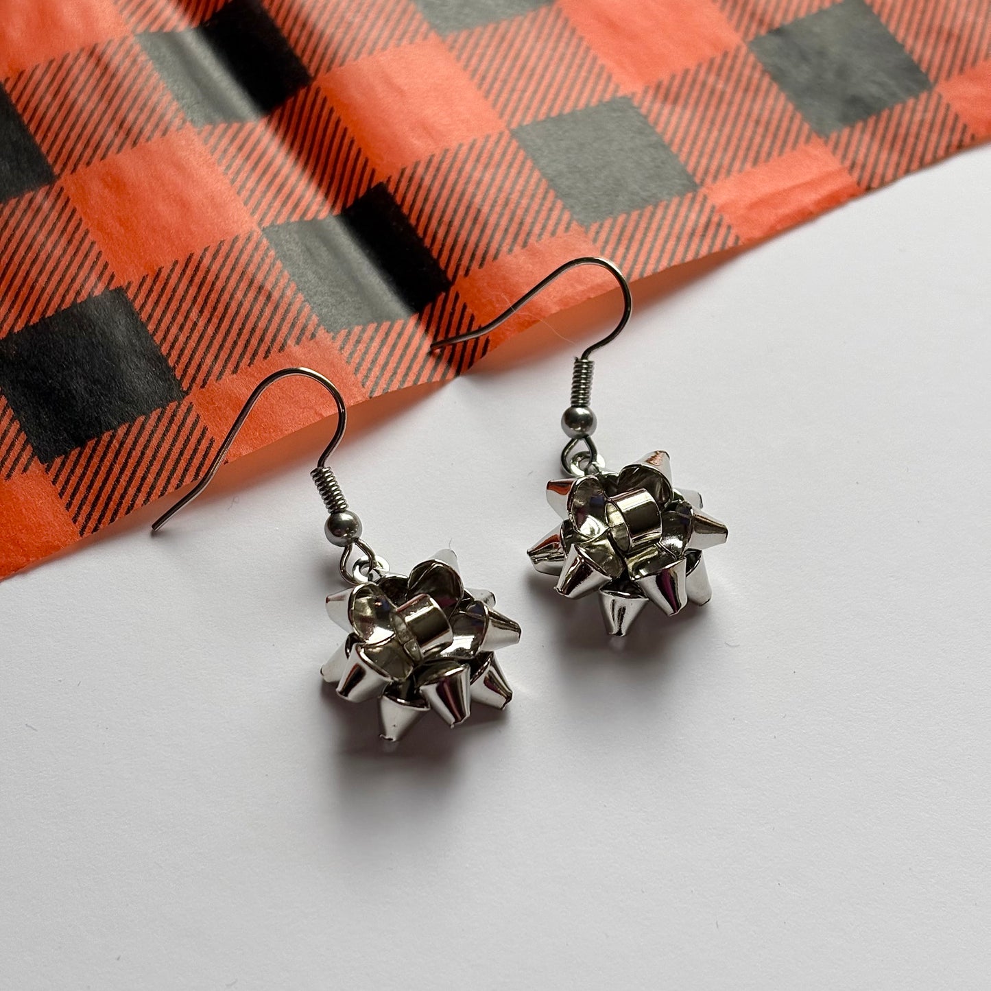 Colourful dangle Christmas fun quirky present bow earrings
