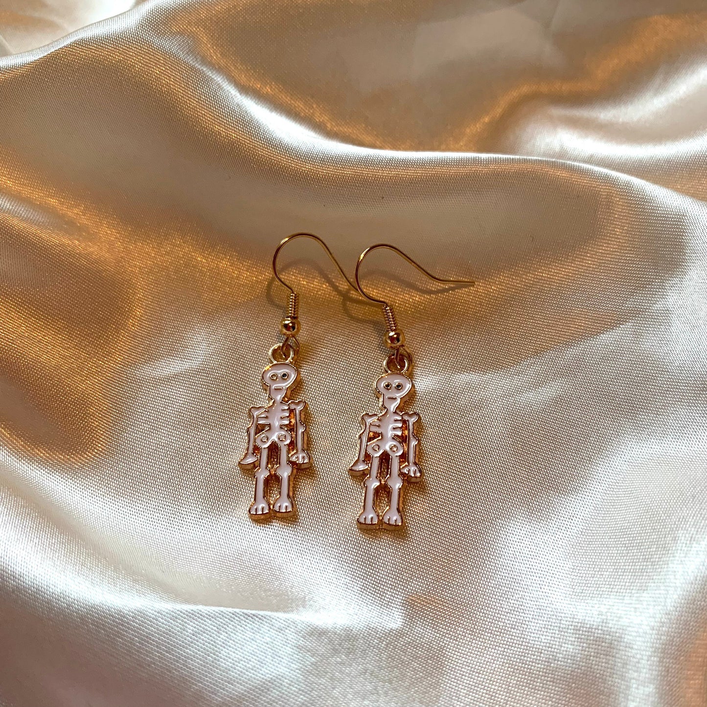 White cartoon skeleton Halloween gold earrings
